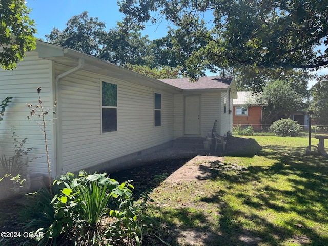 view of home's exterior featuring a yard