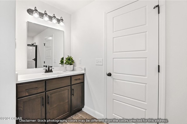 bathroom with tile patterned flooring and vanity