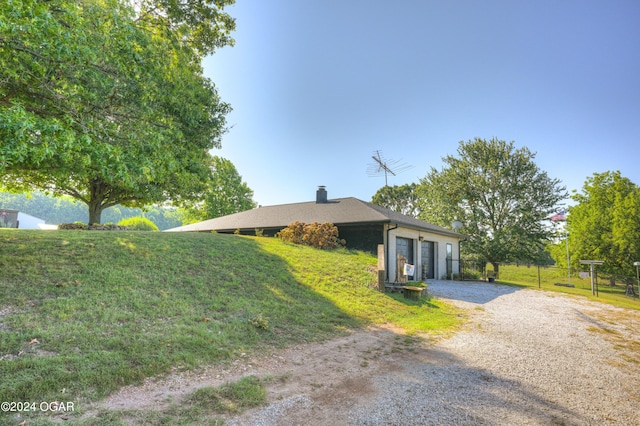 ranch-style house with a front lawn