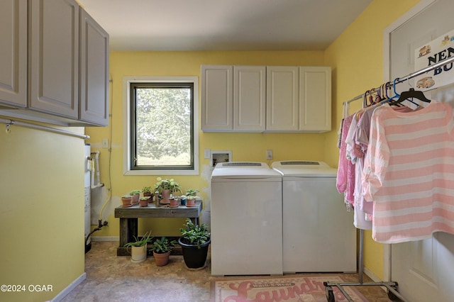 washroom with cabinets and independent washer and dryer