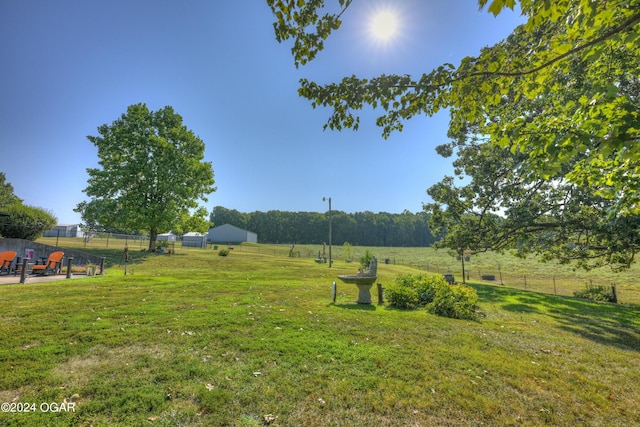 view of yard with a rural view