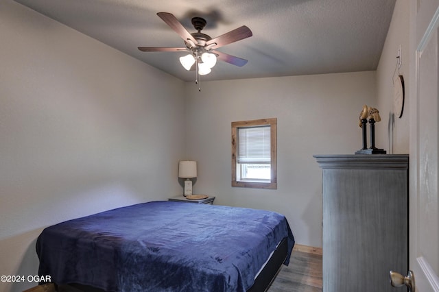 bedroom featuring hardwood / wood-style flooring and ceiling fan