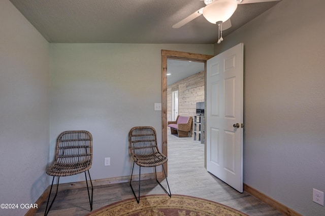 sitting room featuring ceiling fan and light hardwood / wood-style floors