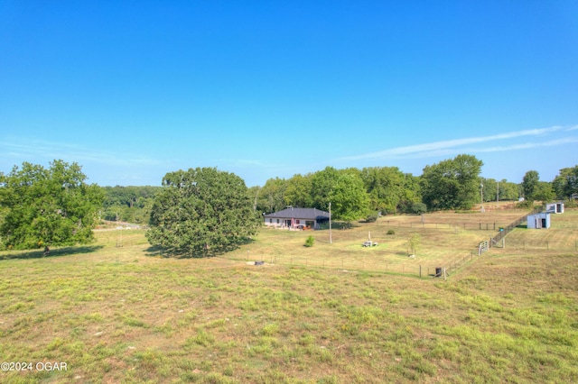 view of yard with a rural view