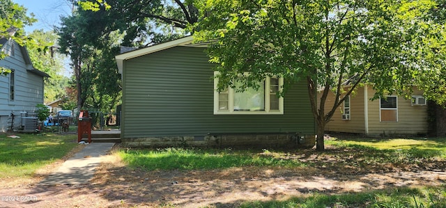 rear view of property with central air condition unit