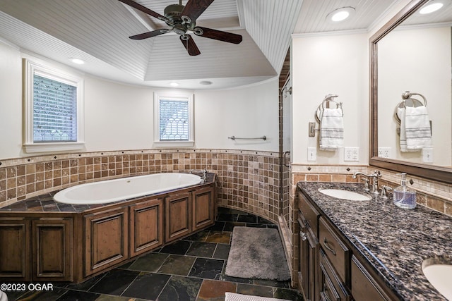 bathroom featuring a tub to relax in, vanity, ornamental molding, tile patterned floors, and ceiling fan