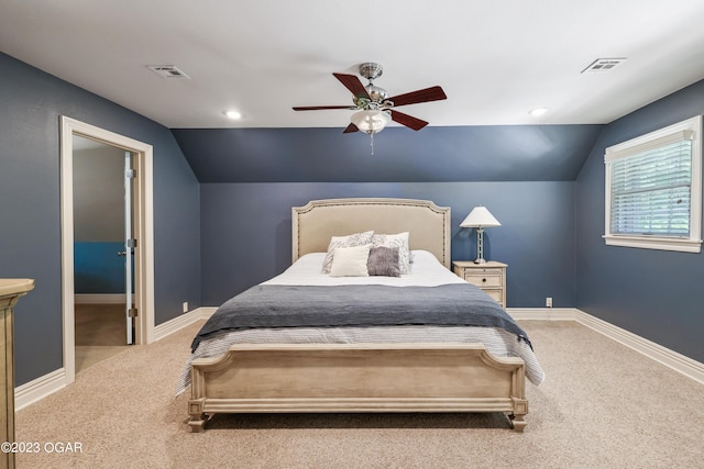 bedroom with ceiling fan, carpet flooring, and lofted ceiling