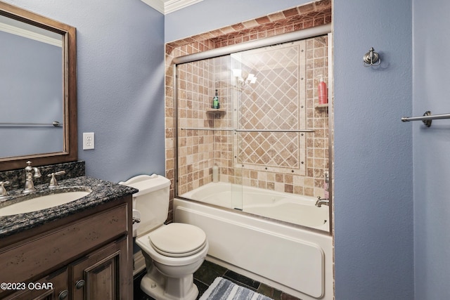 full bathroom featuring combined bath / shower with glass door, toilet, vanity, ornamental molding, and tile patterned floors