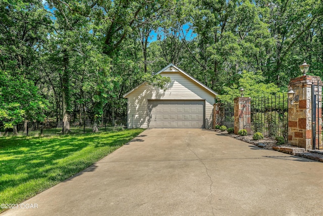 detached garage featuring fence