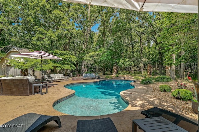 view of pool featuring fence, an outdoor hangout area, a fenced in pool, and a patio