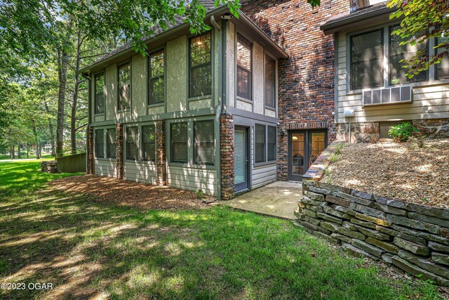 rear view of property with a yard