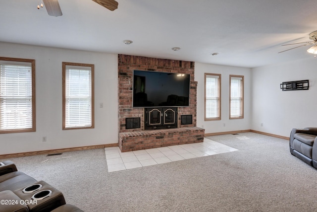 living room featuring a ceiling fan, carpet flooring, visible vents, and baseboards