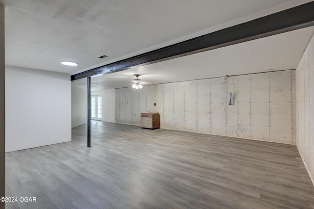 basement with visible vents and wood finished floors