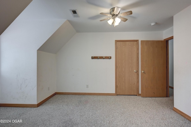 additional living space featuring visible vents, carpet flooring, a ceiling fan, and baseboards