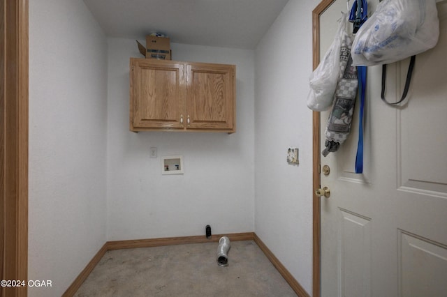 laundry area featuring hookup for a washing machine, cabinet space, and baseboards