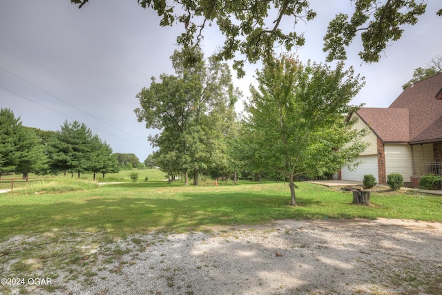 view of yard featuring an attached garage