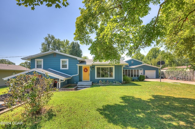 tri-level home with a garage and a front lawn