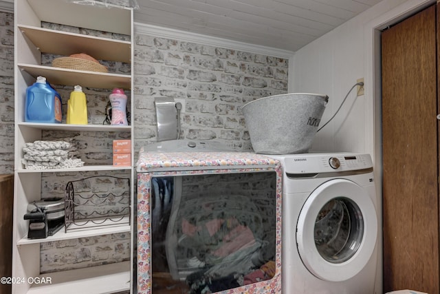 clothes washing area with brick wall, ornamental molding, and independent washer and dryer