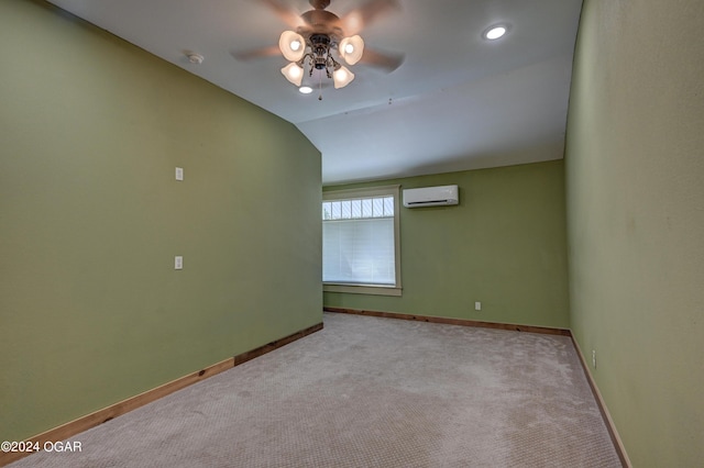 carpeted spare room with vaulted ceiling, a wall mounted air conditioner, and ceiling fan