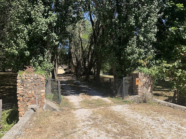 view of gate featuring fence