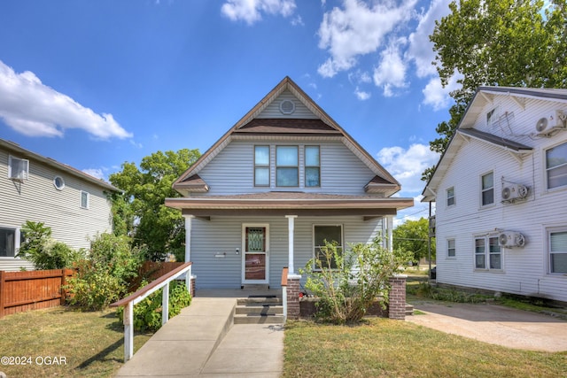 view of front facade featuring a front lawn and covered porch