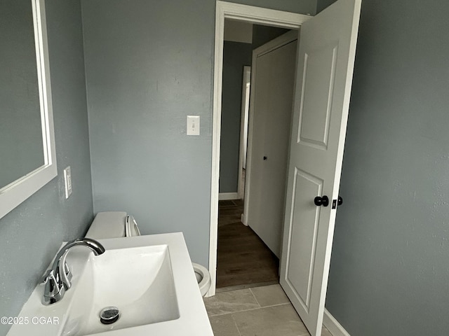 bathroom featuring a sink and toilet