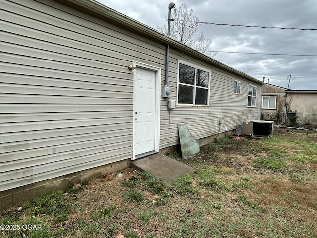 rear view of house with central air condition unit