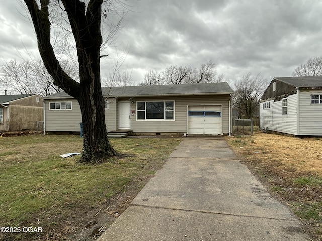 view of front of house featuring a garage, a front yard, driveway, and fence