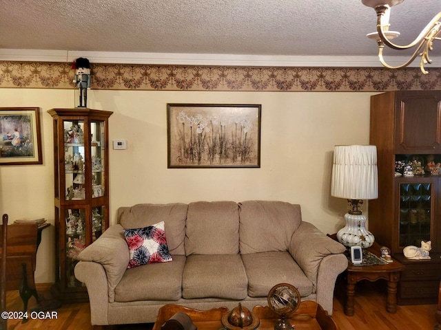 living room featuring a textured ceiling and hardwood / wood-style floors