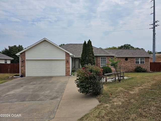 single story home with a front yard and a garage