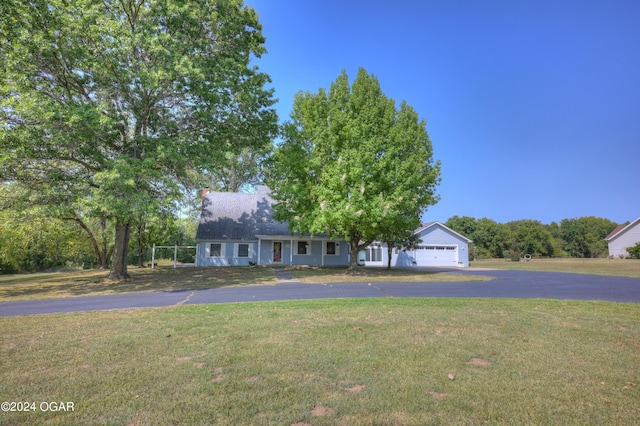 9825 County Rd 215, Webb City, MO 64870 - view of front of home featuring asphalt driveway, a front lawn, and an attached garage
