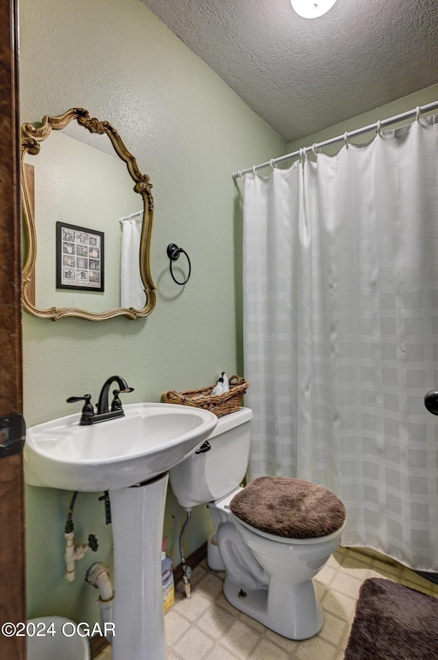 9825 County Rd 215, Webb City, MO 64870 - bathroom with toilet, a textured ceiling, tile patterned floors, and a shower with shower curtain