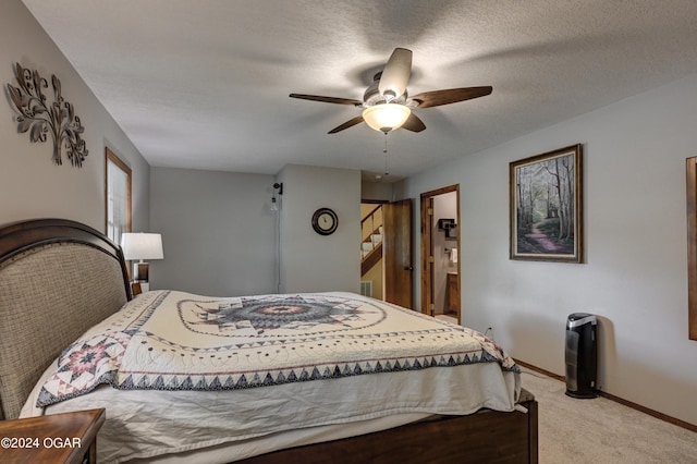 9825 County Rd 215, Webb City, MO 64870 - carpeted bedroom featuring baseboards, ceiling fan, and connected bathroom