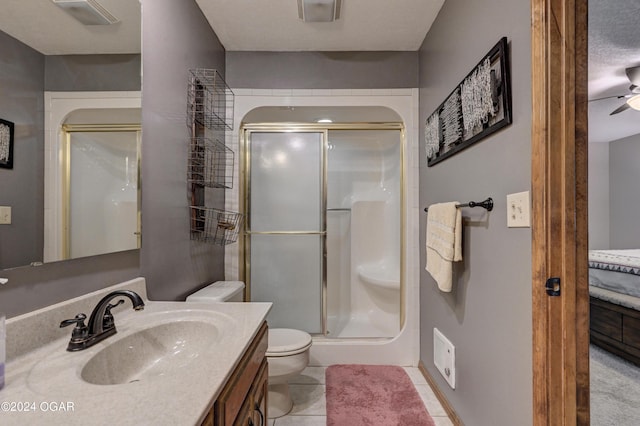 9825 County Rd 215, Webb City, MO 64870 - full bath with toilet, a shower stall, vanity, ceiling fan, and tile patterned flooring