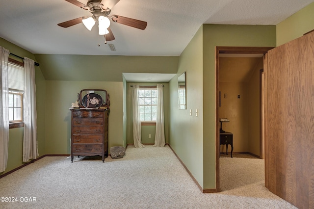 9825 County Rd 215, Webb City, MO 64870 - carpeted bedroom with ceiling fan and baseboards