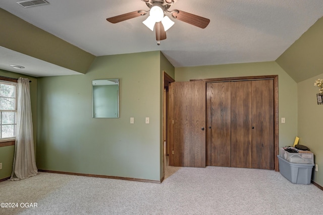 9825 County Rd 215, Webb City, MO 64870 - carpeted bedroom featuring a closet, a ceiling fan, baseboards, and lofted ceiling