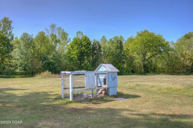 9825 County Rd 215, Webb City, MO 64870 - view of poultry coop featuring a yard and a view of trees