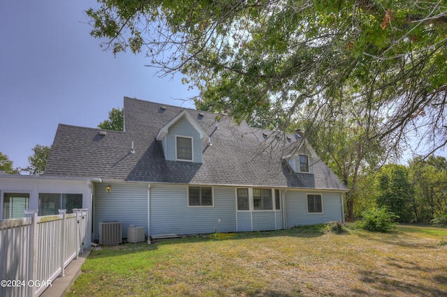9825 County Rd 215, Webb City, MO 64870 - back of property with cooling unit and a shingled roof
