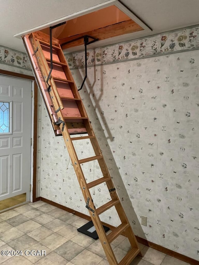 9825 County Rd 215, Webb City, MO 64870 - stairs featuring wallpapered walls and baseboards