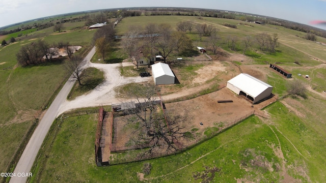 birds eye view of property with a rural view