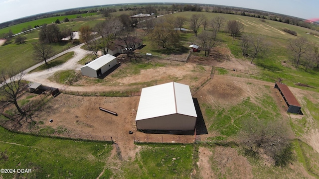 birds eye view of property featuring a rural view