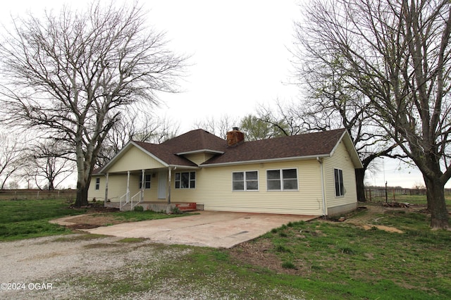 rear view of property with a porch