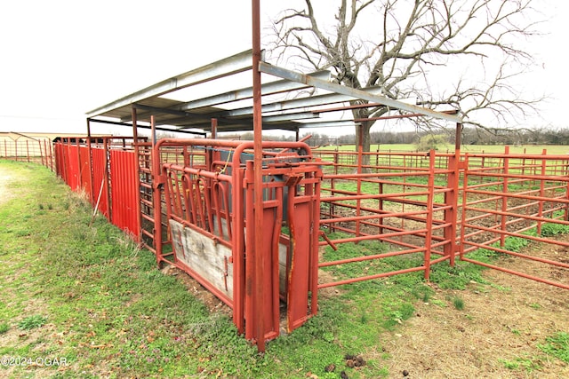 exterior space featuring a rural view and an outbuilding