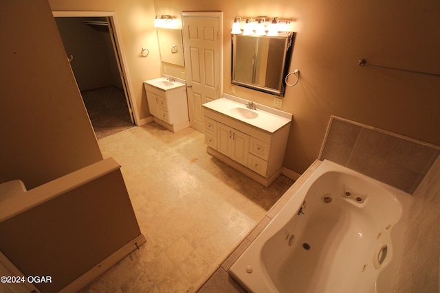 bathroom featuring vanity and a tub to relax in