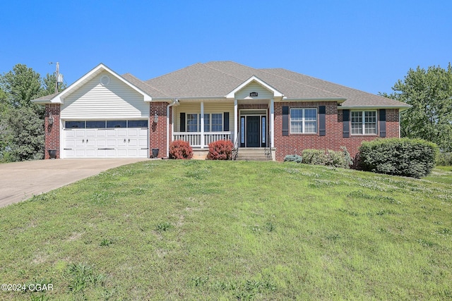 single story home featuring a porch, a garage, and a front yard