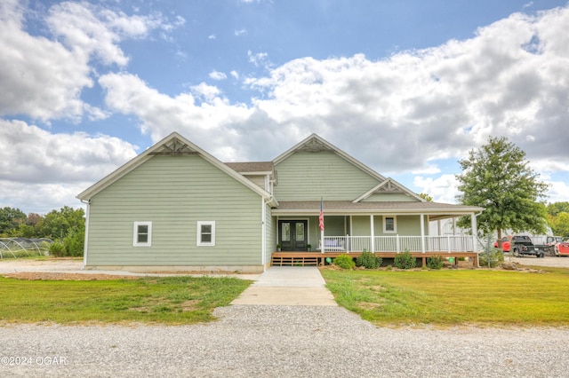 view of front of property with a front yard and a porch