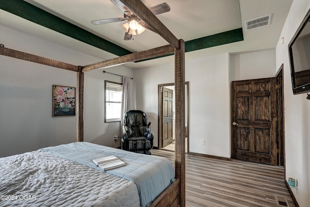 bedroom with wood-type flooring and ceiling fan