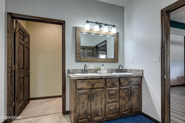 bathroom with vanity and tile patterned floors