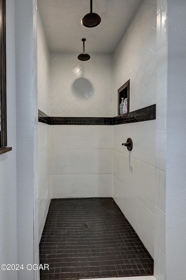 bathroom with tiled shower