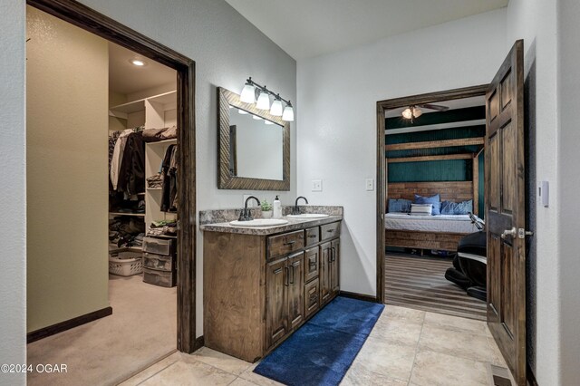 bathroom featuring tile patterned flooring and vanity